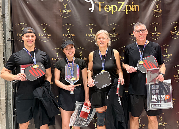 Pickleball player serving