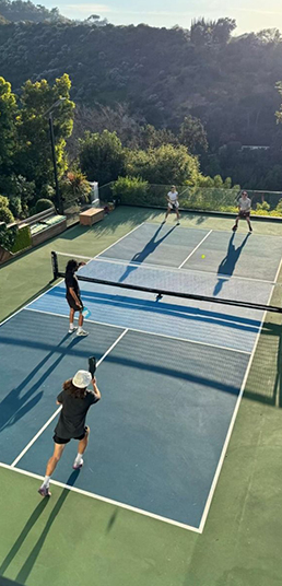Pickleball player serving